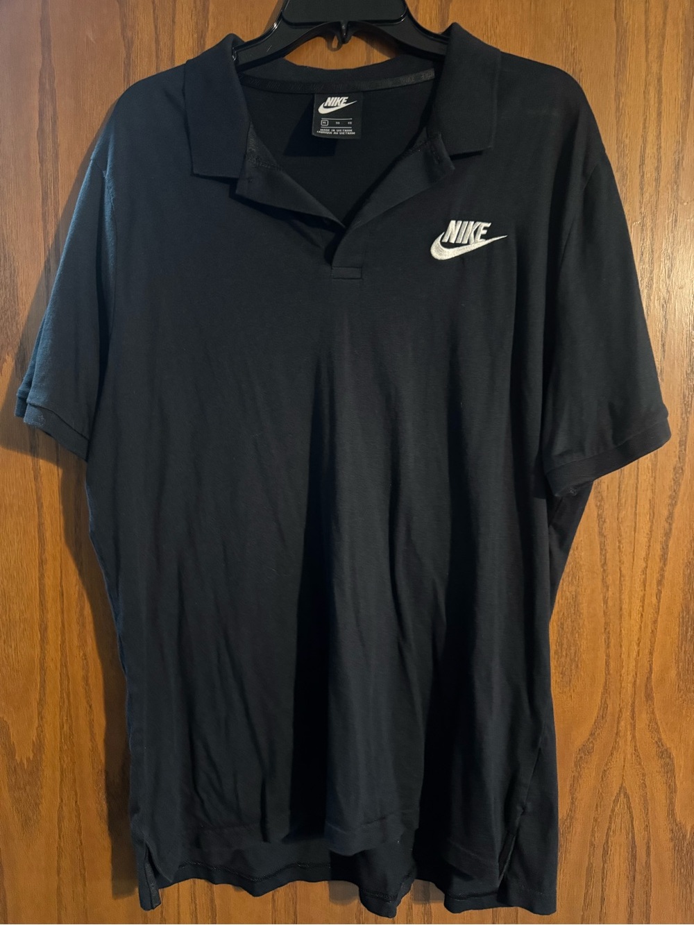 Nike Black Polo with White Swoosh Logo